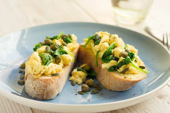the classic comfort scrambled egg and spinach toast